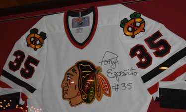 An autographed Tony Esposito Chicago Blackhawks jersey hangs at Sister Bay Bowl, a family-owned supper club and vintage bowling alley in Door County.  WAYNE NEWTON/SPECIAL TO POSTMEDIA