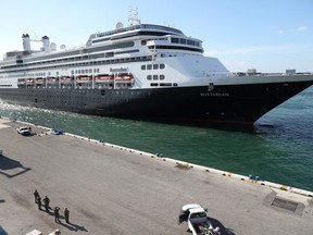 The Rotterdam cruise ship a arrives at Port Everglades on April 02, 2020 in Fort Lauderdale, Florida. The Holland America cruise ship had been at sea for the past 19 days after South American ports denied their entry due to the coronavirus outbreak. Reports indicated that two of four people that died aboard the Rotterdam's sister ship Zaandam had  tested positive for COVID-19. (Photo by Joe Raedle/Getty Images)