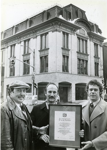 London mayor Al Gleeson and members of the local architecutral conservation advisory committee presented a certificate to two of the four owners of the Duffield Block, Bob Siskind, centre and Tom Wheatley, the building was built in 1871, 1981. (London Free Press files)