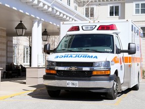 An ambulance is parked in front of Landmark Village retirement home in Sarnia after paramedics unloaded a patient on Thursday. (Mark Malone/Postmedia Network)