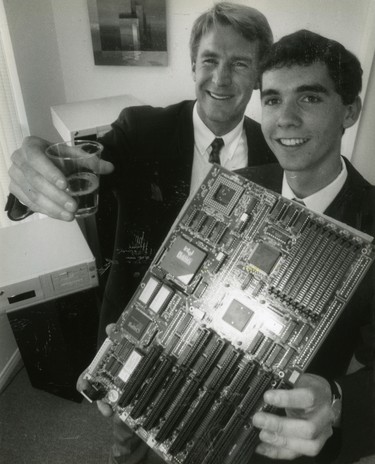 Brian Durnford, left and Christopher Caldwell exhibit a motherboard for a Mirage computer during an open house for their companies Coral Technologies Inc. and Mirage Systems Corp., 1991. (London Free Press files)