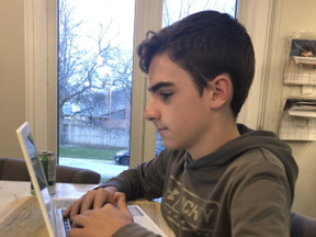 London student Evan Maloney doing schoolwork at home after classes resumed amid isolation on Monday April 6, 2020.