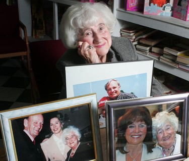 Fanny Goose, who family called the “matriarch of the local Liberals,” shows off treasured pictures of her with former prime ministers Jean Chretien, left, and Paul Martin and Margaret Trudeau, in 2007. Goose died of heart failure Monday, April 13, 2020. (Files)