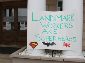 Handmade signs supporting staff at Landmark Village retirement home, where multiple people have been diagnosed and died from COVID-19, were posted at the building’s front entrance on Wednesday April 1, 2020 in Sarnia. Paul Morden/Sarnia Observer