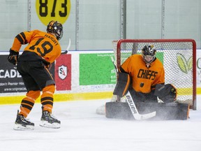 Marcus Vandenberg stops a shot by Hunter Haight during Elgin-Middlesex Chiefs AAA minor midget practice in Komoka. (Derek Ruttan/The London Free Press)