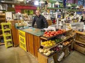 Chris Doris is happy to be back at work at Doris Family Produce at the Covent Garden Market after it re-opened for business in London on Wednesday April 1, 2020. The produce stand has been operating at the market for 46 years. (Derek Ruttan/The London Free Press)