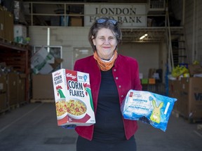Jane Roy, co-director of the London Food Bank, stands at the charity's loading dock where the annual spring food drive was launched Friday. This year's version will be asking for money rather than food items. (Derek Ruttan/The London Free Press)