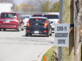 Ten vehicles were lined up when the COVID-19 assessment centre at Oakridge Arena opened this morning in London, Ont. on Thursday April 16, 2020. (Derek Ruttan/The London Free Press)