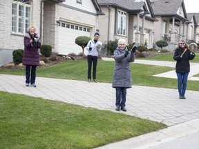 Residents of nearly 100 homes on Blue Jay Drive are expected to participate in a mass thank-you to health-care workers by banging pots and pans at 7:30 p.m. on Saturday. Among those intending to take part are Sharron Versaevel, left, Denise Blay, Irene Ihnat and Cathy Thornton. (Derek Ruttan/The London Free Press)