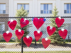Hearts thanking employees hang on the fence surrounding the Henley Place Long Term Care Residence in London on April 20, 2020. (Derek Ruttan/The London Free Press)