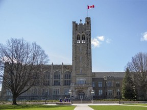 Students gather at the base of University College at Western University. (Derek Ruttan/The London Free Press)