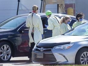 Nine vehicles were lined up at the COVID-19 assessment centre at the Carling Heights Optimist Community Centre. Derek Ruttan/The London Free Press/Postmedia Network