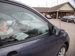 Police were keeping an eye on the Church of God in Aylmer on Sunday. In defiance of an order by the town's chief of police, the church held a drive-in service Sunday. Hundreds of parishioners sat in parked vehicles watching Hildebrandt on stage and listening to his sermon over their FM radios. Police videotaped the event. Derek Ruttan/London Free Press