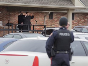 Police were keeping an eye on the Church of God  in Aylmer, Ontario on Sunday April 26, 2020. In defiance of an order by the town's chief of police, the church held a drive-in service Sunday morning. Hundreds of parishioners sat in parked vehicles watching Hildebrandt on stage and listening to his sermon over their FM radios. Police video taped the event but have not yet laid charges. Derek Ruttan/The London Free Press/Postmedia Network