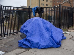 A tent is being used for shelter on the sidewalk in front of the Salvation Army's Centre of Hope in London. Homeless advocates say at least 46 people experiencing homelessness died in London from January to October this year, compared to 31 who died in all of 2020. (Derek Ruttan/The London Free Press file photo)