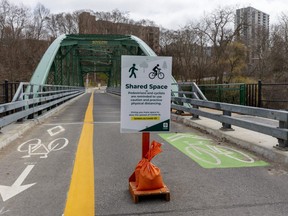 London's iconic Blackfriars Bridge, is once again a pedestrian and cycling only bridge due to the COVID-19 pandemic. A city sign stating the need for social distancing has opened up the bridge to cyclists traveling in both directions with enough room for them to pass safely in London.  (Mike Hensen/The London Free Press)