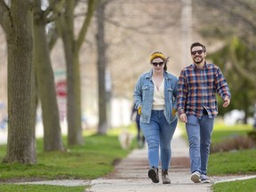 Becky Goodwin and Erik Hodgins have rediscovered the joy of walking due to the COVID-19.  (Mike Hensen/The London Free Press)