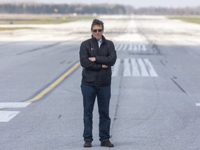 London International Airport president Mike Seabrook stands on its main runway (Mike Hensen/The London Free Press)