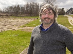 Benjamin Hill stands near the community gardens located just south of Commissioners Road on Reservoir Hill for Megan Stacey story on the push to make community gardens an essential service in London.  Mike Hensen/The London Free Press)