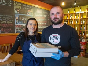 Laura Del Maestro and Mario Jozic, owners of the London Wine Bar, have gone into the takeout business since the restaurant had to close because of the pandemic and are using tips to donate meals to front-line workers. They are also delivering food to 20 families in need in London. (Mike Hensen/The London Free Press)