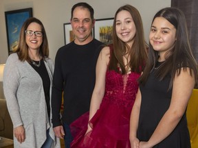 Julie and Bill Low with their daughters Rachel, 17 and Natalie, 14 who had their high school prom and grade school proms online due to COVID-19 restrictions in London, Ont.  Photograph taken on Thursday April 23, 2020.  Mike Hensen/The London Free Press/Postmedia Network