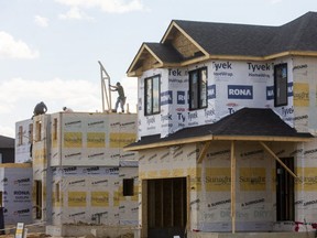 Workers continue to frame houses between Sunningdale and Fanshawe Park Road east of Hyde Park in London, Ont.  (Mike Hensen/The London Free Press)