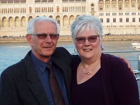 Joe Agocs and his wife, Lynda, are seen here in near the Hungarian Parliament Building in Budapest. Handout/Sarnia Observer/Postmedia Network