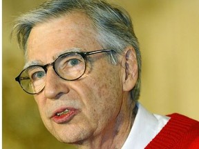 File photo dated 03 April 2002 shows legendary children's television star Fred Rogers of "Mister Rogers' Neighborhood" endorsing the PBS television show for children called "Between the Lions" in the East Room of the White House.