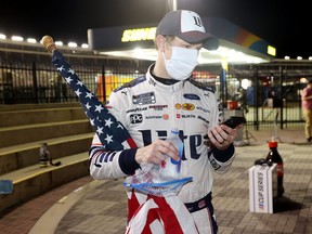 Brad Keselowski, driver of the #2 Miller Lite Ford, makes a call in Victory Lane after winning the the NASCAR Cup Series Coca-Cola 600 at Charlotte Motor Speedway on May 24, 2020 in Concord, North Carolina.
