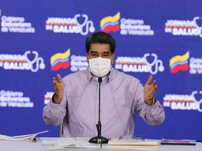 Handout picture released by Venezuelan Presidency showing Venezuela's President Nicolas Maduro speaking during a televised message, at Miraflores Presidential Palace in Caracas on May 14, 2020, amid the novel coronavirus, COVID-19, pandemic. (Photo by - / Venezuelan Presidency / AFP)