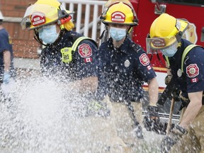 Markham firefighters on the scene of an explosion in a townhouse in the city north of Toronto on Sunday May 17, 2020. Veronica Henri/Toronto Sun