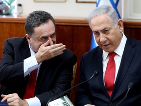 FILE PHOTO: Israeli Prime Minister Benjamin Netanyahu listens to Foreign Minister Israel Katz during the weekly cabinet meeting in Jerusalem October 27, 2019. Gali Tibbon/Pool via REUTERS/File Photo ORG XMIT: FW1