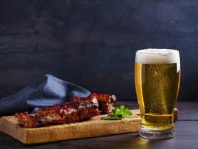 Beer and pork spare ribs. Ale and meat. Beer and food concept - Image