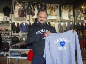 Curt Collins of Collins Formal Wear shows off his Canada Strong brand of clothing Wednesday, May 6, 2020. Collins launched the line after his formal-wear business was flattened by the pandemic. The Canada Strong line of casual wear has been popular with Canadians. (Derek Ruttan/The London Free Press)