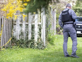 London police probing an east-end convenience store robbery recovered stolen property and a replica handgun during a search of a  townhouse on Culver Drive in London Friday. (Derek Ruttan/The London Free Press)