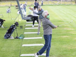 John Lafferty and many others were working on their golf game at Tin Cup Driving Range and Mini-Putt on May 20, 2020. (Derek Ruttan/The London Free Press)