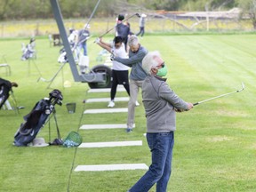 John Lafferty and many others were working on their golf game at Tin Cup Driving Range and Mini-Putt in London, on Tuesday. "It's wonderful to be open again," said owner Dan Windsor. "The customers are at minimum 10 feet apart on the driving range so it works well."  Unfortunately, social distancing rules have prevented the re-opening of the mini-putt course. Derek Ruttan/The London Free Press/Postmedia Network