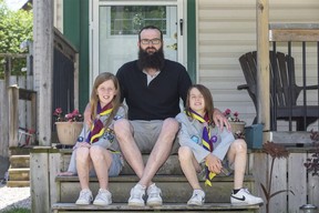 Josh Farrell of St. Thomas is fighting for a partial refund of fees paid to Scouts Canada for his Cub Scout children, Bella, 10, left, and Levi, 9, since many activities are cancelled due to COVID-19. (Derek Ruttan/The London Free Press)