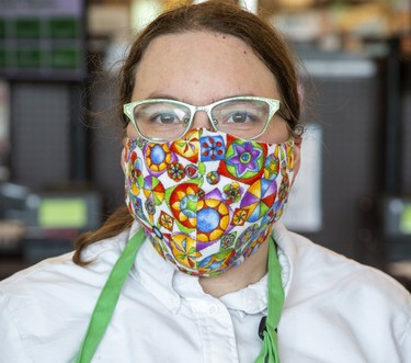 Thirty-two year old Heather Donoy received her mask from her employer, Sobeys Extra on Wonderland Road. Photo shot in London, Ont. on Wednesday May 27, 2020. Derek Ruttan/The London Free Press/Postmedia Network