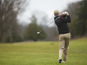 A golfer tees off at Thames Valley Golf course in this file photo.