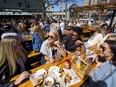 Western University students Randall Miller, Jordan Koop, Rav Datta and Alexa DeLuca soaked up the sun on Barney's patio in this file photo. (Free Press files)