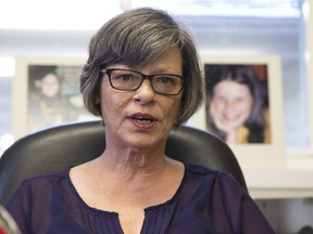 Flanked by photos of herself as a girl, Irene Deschenes held a press conference to announce that she has won a court challenge to re-open a civil suit against the Catholic Church that was originally settled in 2000. The photos behind her were taken by her abuser, Catholic priest Charles Sylvestre. Photo shot in Strathroy, Ont. on Thursday December 6, 2018. Derek Ruttan/The London Free Press/Postmedia Network