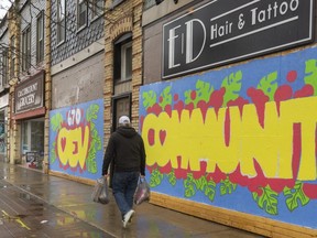 Closed storefronts on Dundas Street just west of Elizabeth trumpet the OEV Community with bright colours. (Mike Hensen)