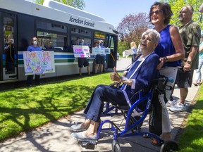 Diane Chenier, the LTC's first female driver is feted outside her home by LTC drivers who credit her for opening the doors and leading the way for female drivers in London, Ont.  A large parade followed the bus filled with drivers and signs. Photograph taken on Thursday May 21, 2020.  Mike Hensen/The London Free Press/Postmedia Network