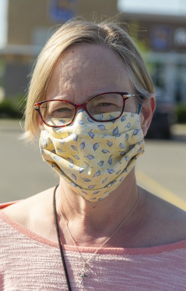 Linda Cousins 60, of London said about her mask, "it was made by a friend in church, who was making masks out of spare fabric and giving them to anybody who asked for one.  Photograph taken on Tuesday May 26, 2020.  Mike Hensen/The London Free Press/Postmedia Network