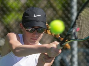 Kayla Cross, 15 follows through on a backhand during a morning practice in London. (Mike Hensen/The London Free Press)