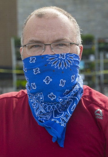 Ben Rubin, 49, of London Basically if a lot of people wear them (masks) we protect each other. The bandana tends to fall down, then you have to touch your face, which isn't good," he said. Photograph taken on Wednesday May 27, 2020.  Mike Hensen/The London Free Press/Postmedia Network