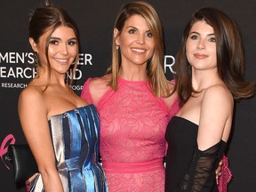 Lori Loughlin (C) and her daughters, Olivia Jade Giannulli (L) and Isabella Rose Giannulli attend The Women's Cancer Research Fund's An Unforgettable Evening Benefit Gala at the Beverly Wilshire Four Seasons Hotel on Feb. 28, 2019 in Beverly Hills, Calif.