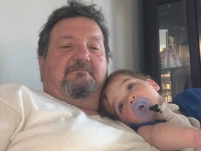 Darcy Krauza, pictured here with his grandson Elijah, was killed in a motorcycle crash in St. Thomas in May 16. The driver of the SUV that collided with Krauza has been charged, police said Tuesday. (Photo supplied by Chris Krauza)