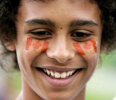 CANADA DAY 2009: Jacob Ariaratnam, 12, of London enjoys the Canada Day celebrations at the White Oaks Community Centre. (Mike Hensen/The London Free Press)